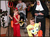 Trick or Treating at the mall...........the ice cream shop was giving out free cones to the kids............that's my mom as the nun............:)